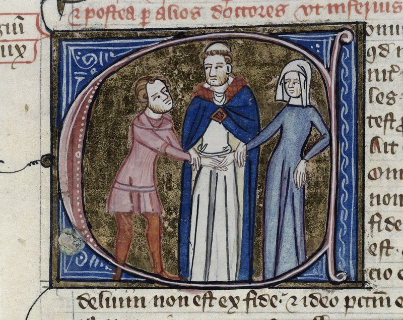 An old scroll image of a very unhappy looking monk.