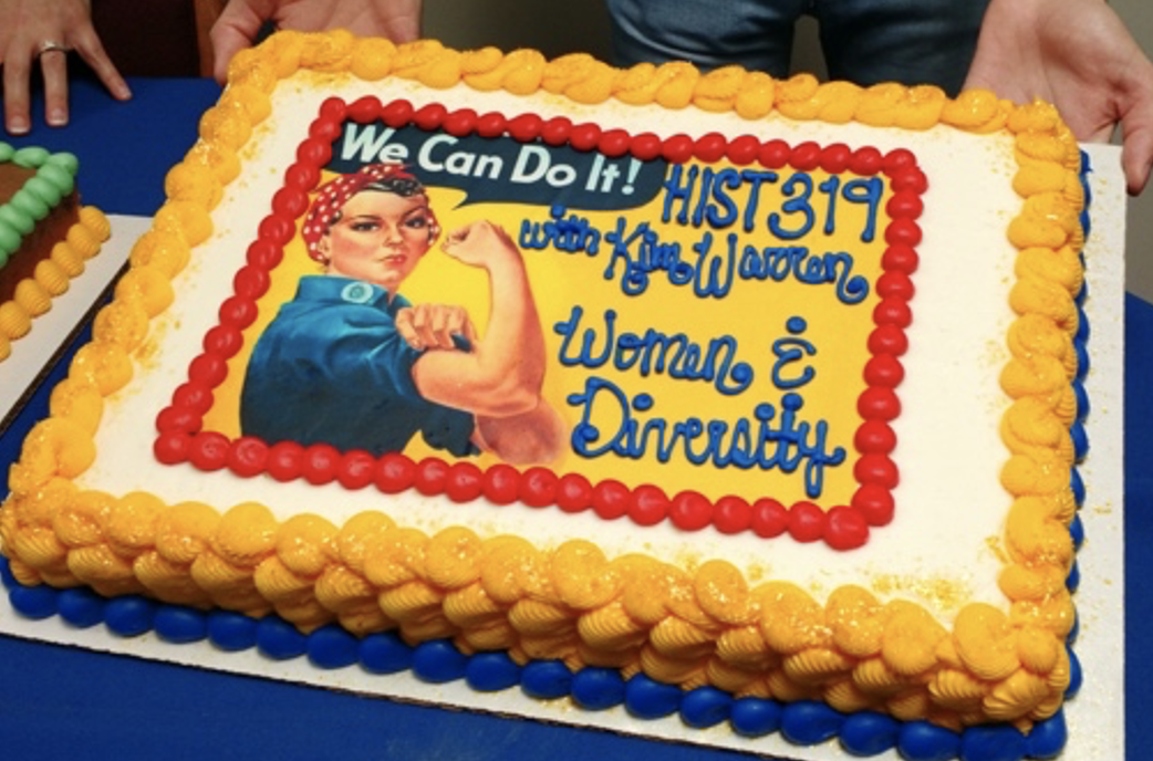 an image of rosie the riveter on a cake