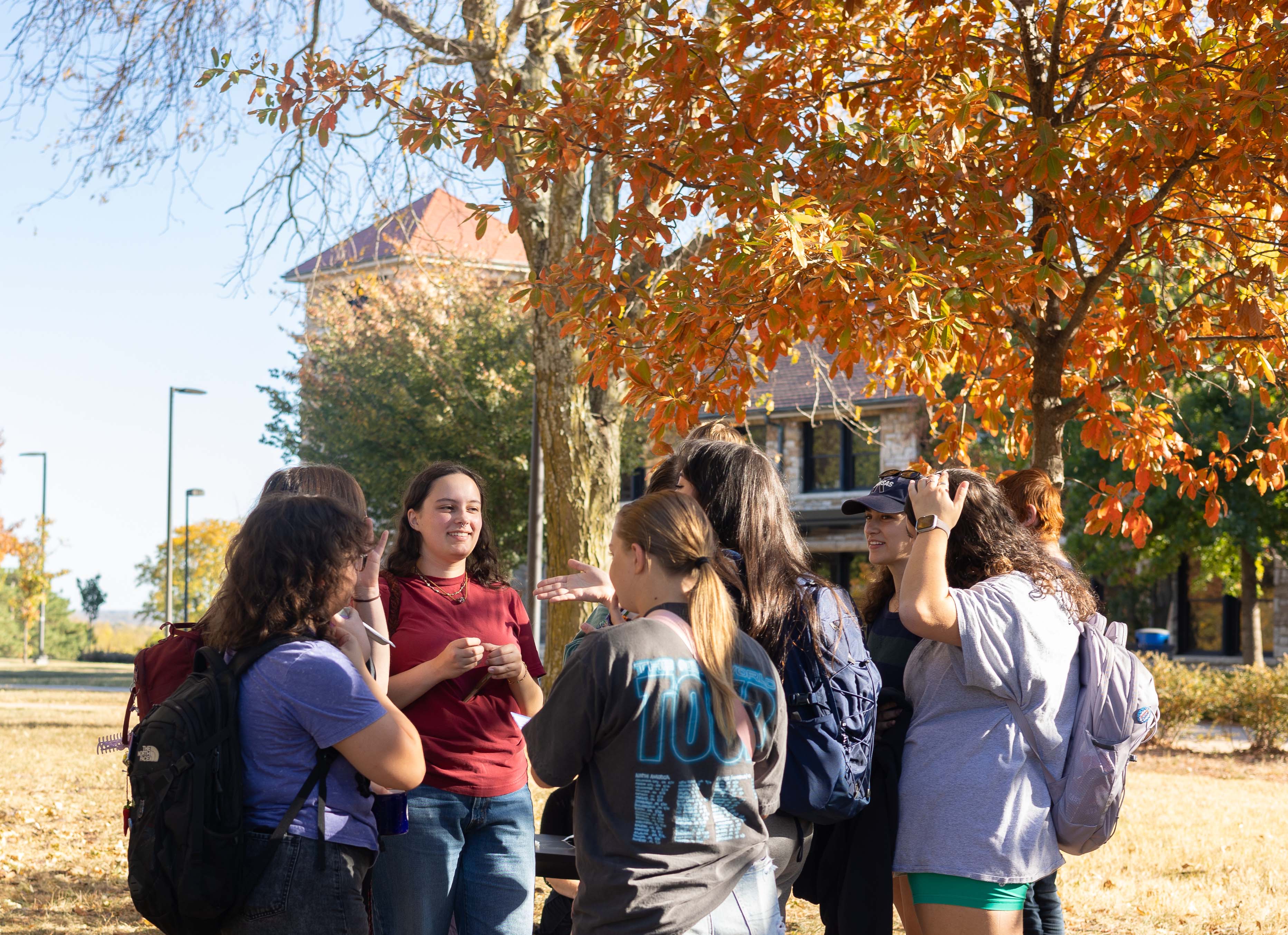 Students in a circle talking