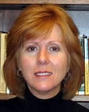Woman wearing a black turtleneck. 