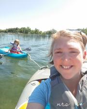 woman in a kayak smiling