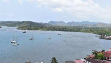 The bay of Portobelo, from the viewpoint of the 17th century Spanish fort (built by enslaved Africans) that looks upon hills housing the likely site of Santaigo del Príncipe, was the first community established by former maroons after their peace with the Spanish. Photo by Robert Schwaller.